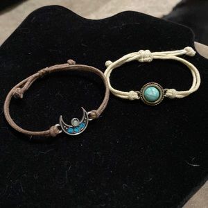 Two string bracelets with blue and centerpieces